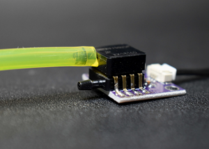 PVC Pitot tube connected to two hoses entering the sensor