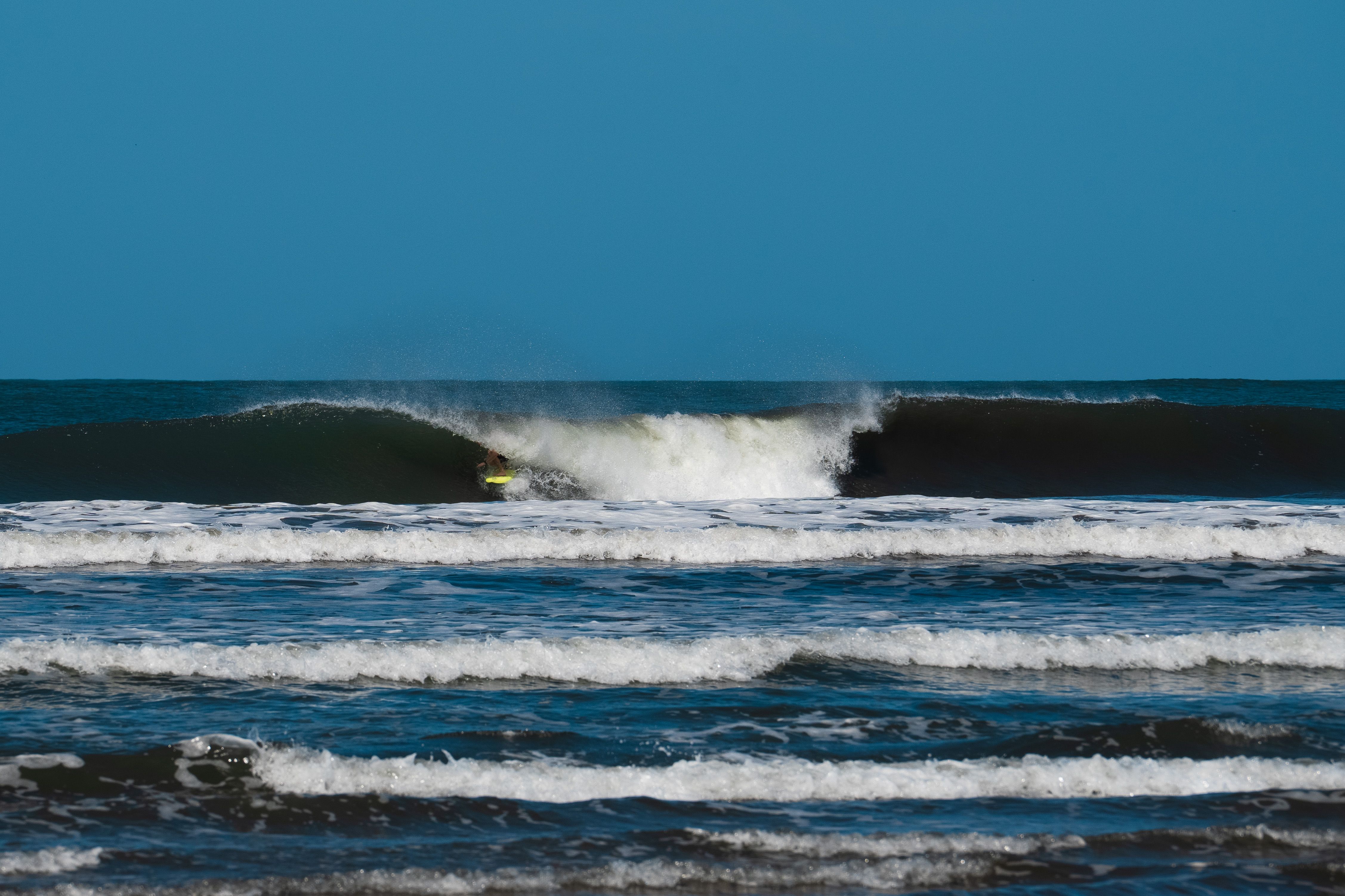 Surfing: The Physics of Being Carried by a Wave